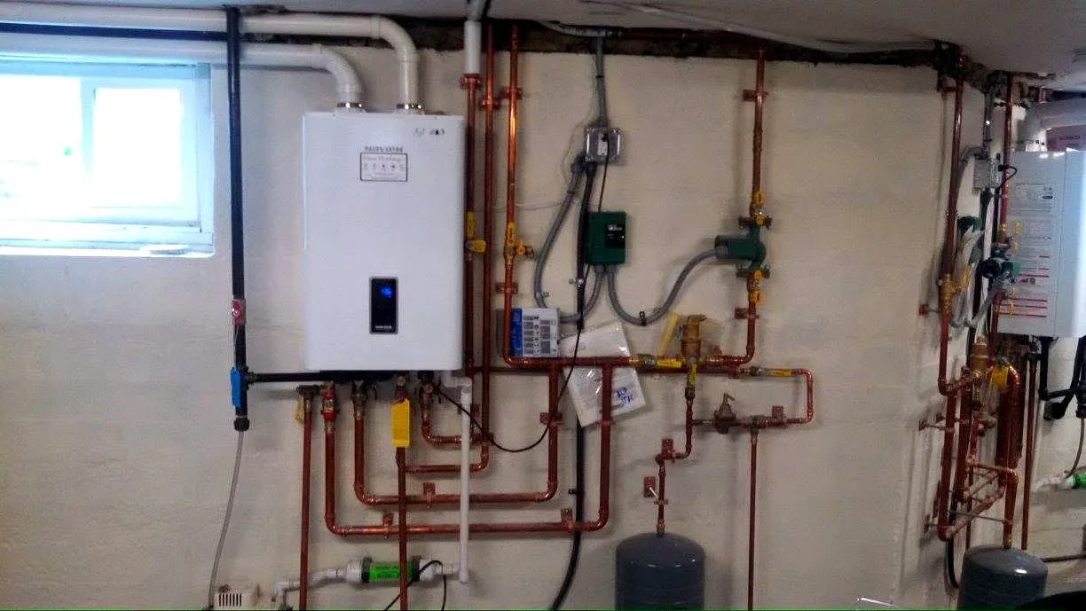 Prime Plumbing Navien tankless water heater installation with copper piping and recirculation in a Greater Boston home